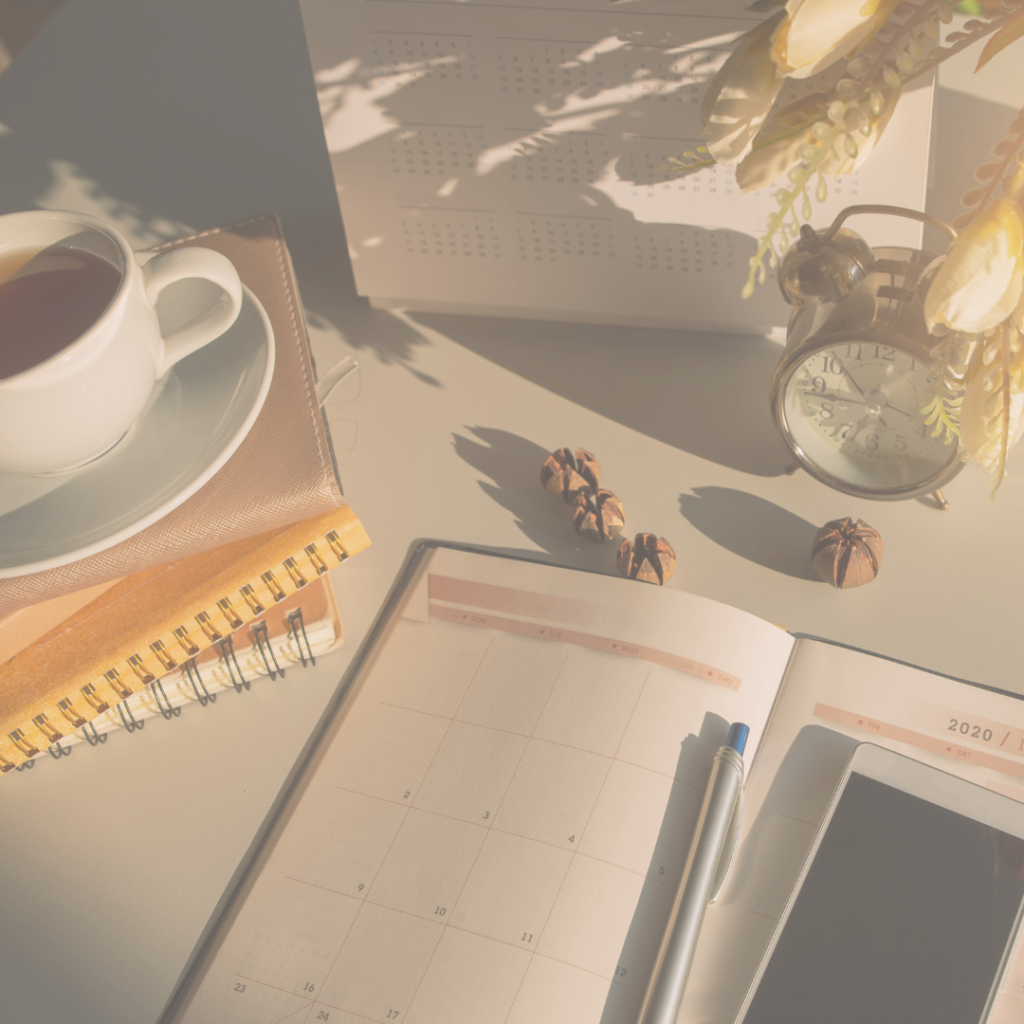 calm desk with diary, telephone and cup of tea