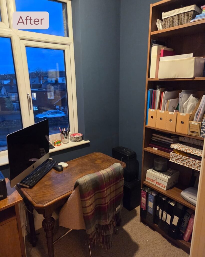 A calm organised study with paperwork neatly organised in files.
