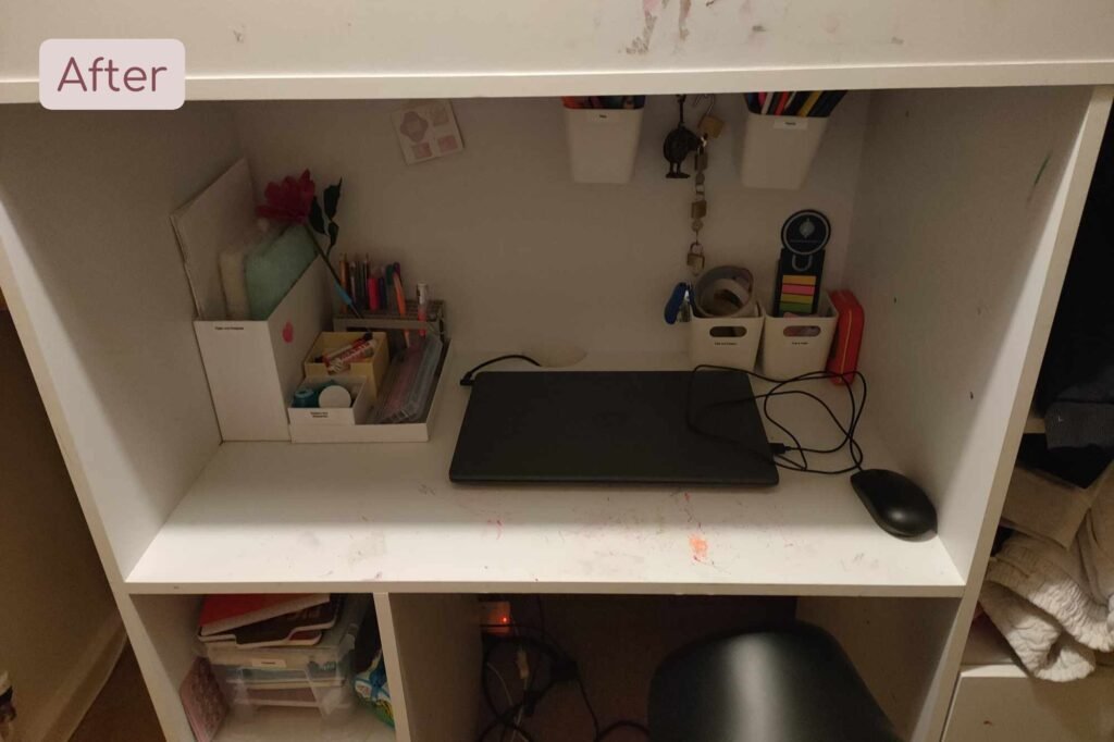 a desk with clear space to work at and organised stationary pots