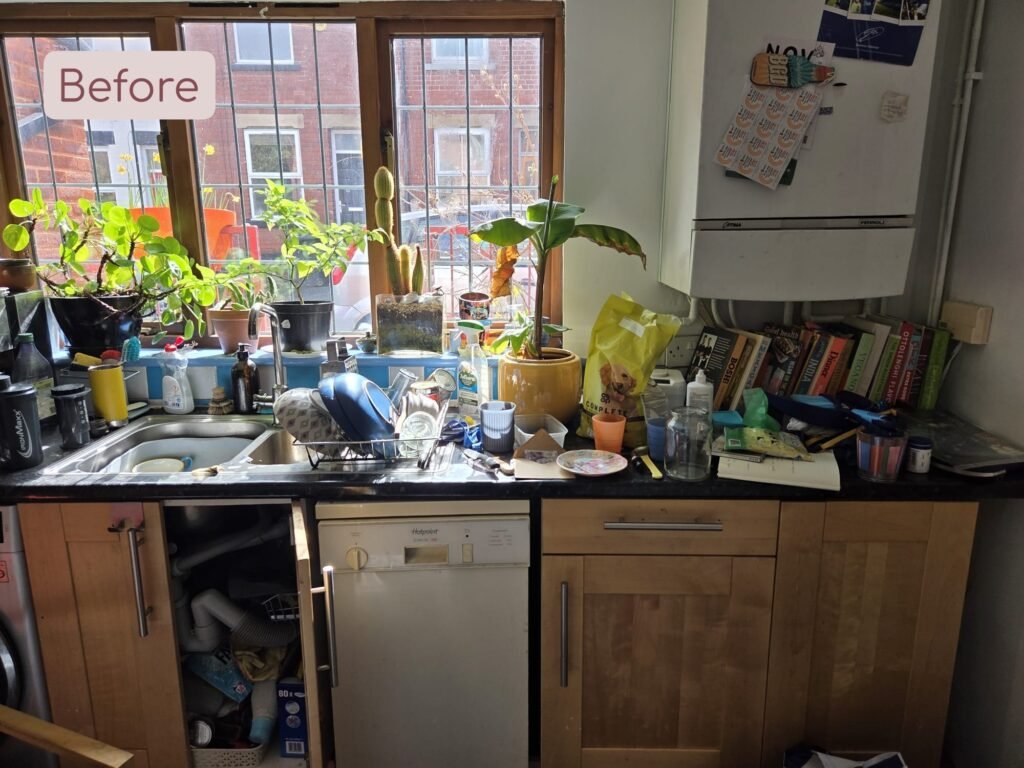 a cluttered kitchen and countertops